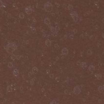 A textured brown surface with a mottled, speckled pattern resembling leather, cork, or similar natural material.