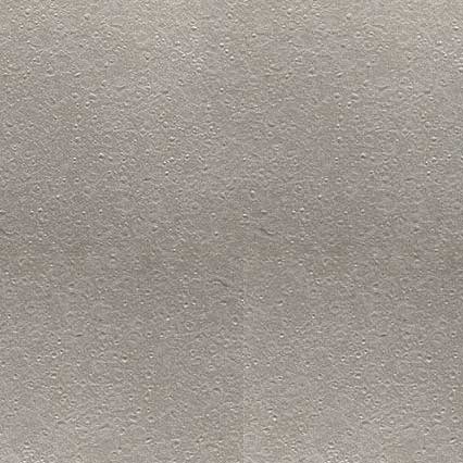 A textured beige or taupe surface with a fine, consistent grain pattern and subtle speckled appearance, resembling leather or similar material.