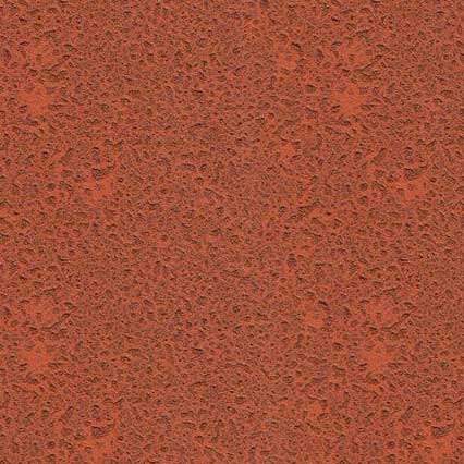 A textured reddish-brown surface with a fine, granular pattern resembling clay court material or rust-colored sand with small dark speckles throughout.