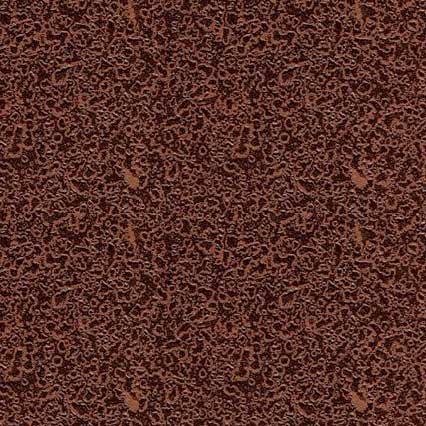 A close-up view of finely ground dark brown cocoa powder or chocolate powder with a uniform, granular texture covering the entire surface.