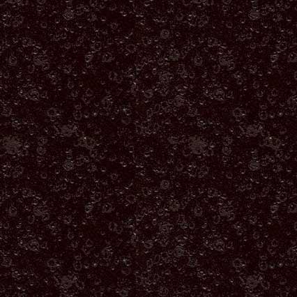 A dark, textured surface with a mottled pattern of deep brown and black tones, resembling soil, carpet, or another granular material.