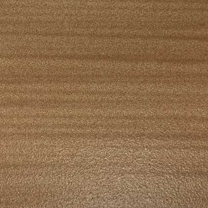 A smooth, tan-colored leather texture with natural grain patterns and subtle variations in tone across the surface.