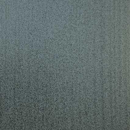 A textured surface with a mottled gray-green pattern featuring fine, irregular speckles distributed evenly across the entire area.