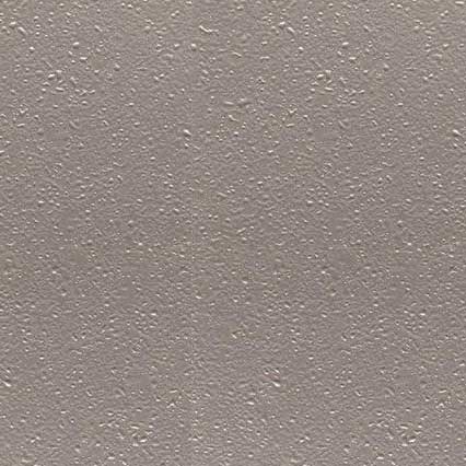 A textured beige or taupe surface with a subtle speckled pattern and slightly rough, matte finish resembling painted drywall or stucco.