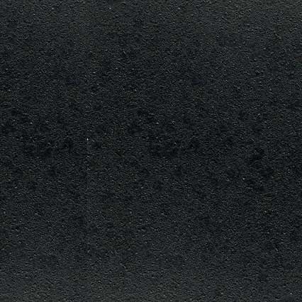 A dark textured surface with a fine, granular pattern resembling leather, fabric, or similar material with subtle variations in shading across the surface.