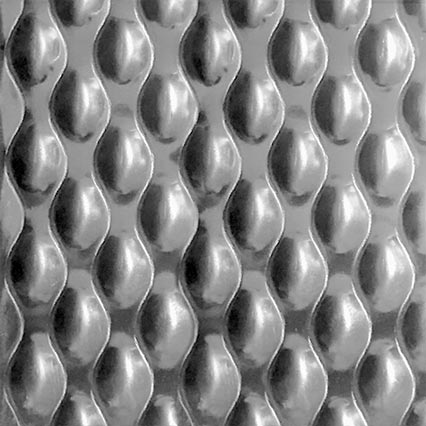 A repeating pattern of three-dimensional oval or egg-shaped forms arranged in vertical columns, creating a textured surface with consistent shadows and highlights that gives the appearance of embossed or molded material.