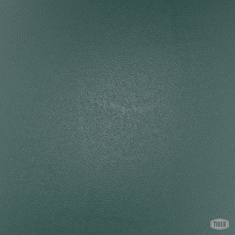 A textured green leather or vinyl surface with a subtle grain pattern and slight sheen, featuring a small 